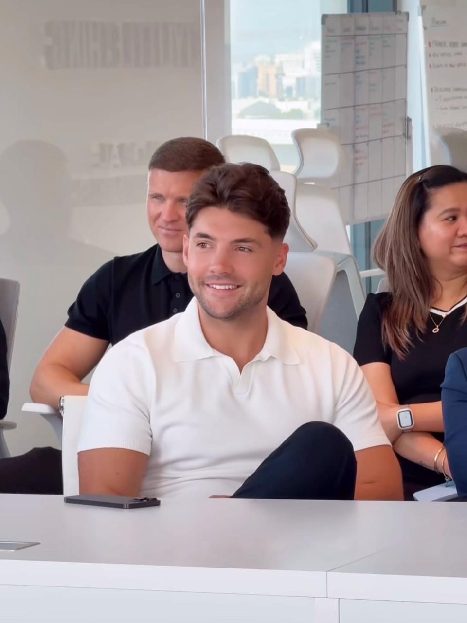 Jake with his team at the office